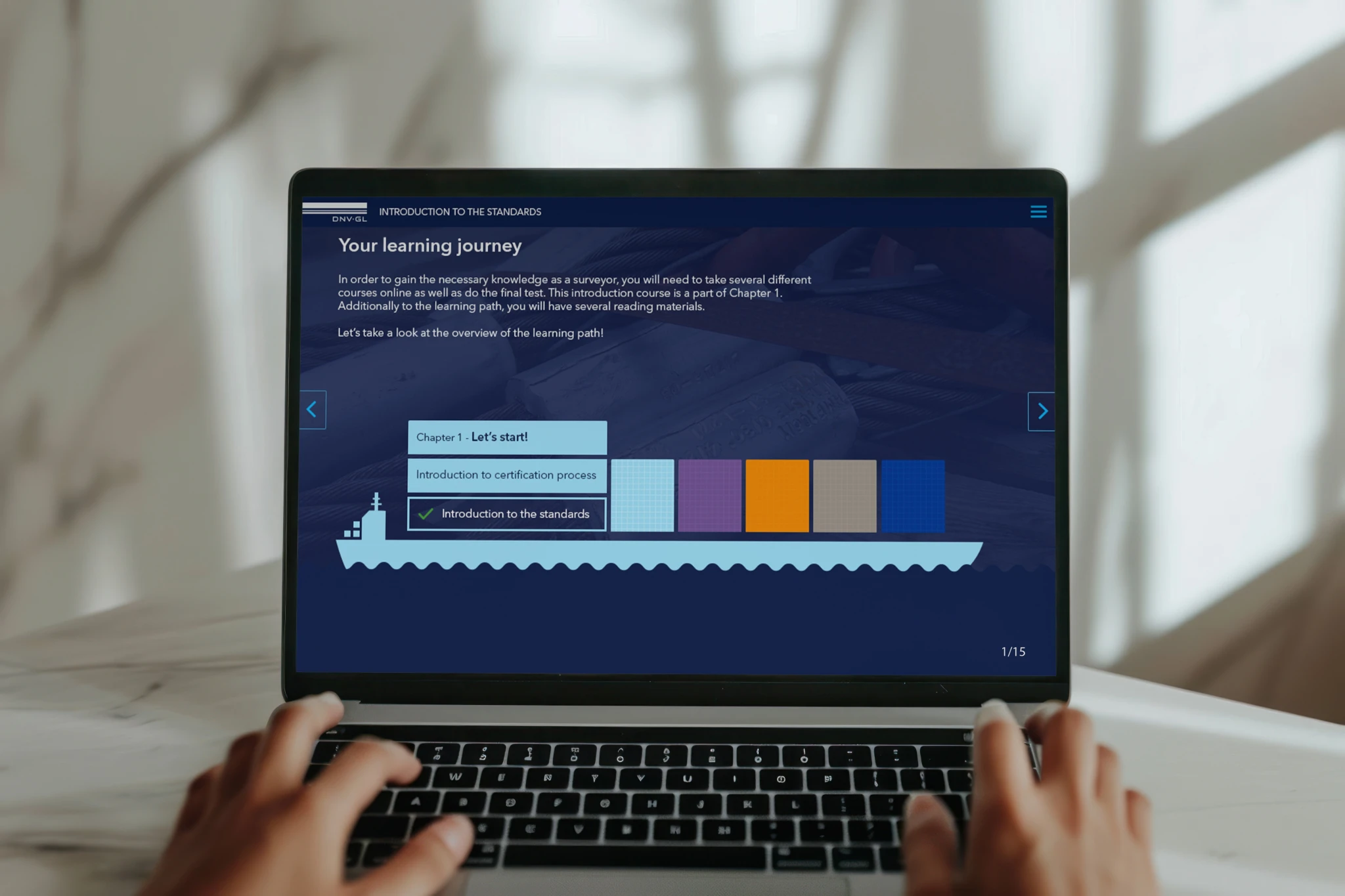 Laptop displaying an interactive certification standards learning path.